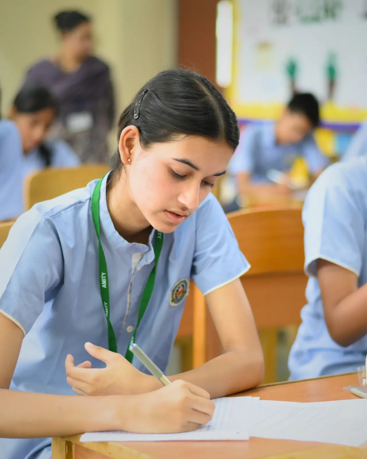 Amity International School Viraj Khand students giving exam in classroom